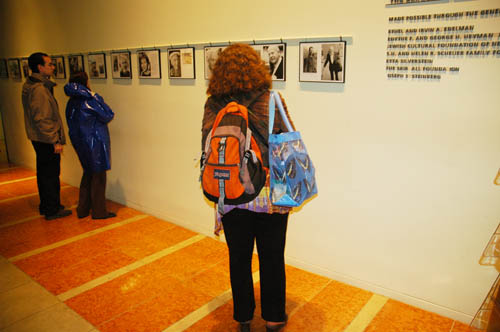 Woman looking at galery photographs