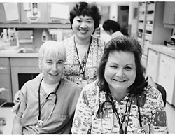 Three smiling nurses