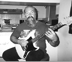 Andy Chritiansen playing the guitar