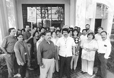 Group of socia workers demonstrating infront of their office building