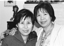 Two nurses one with arm around the other