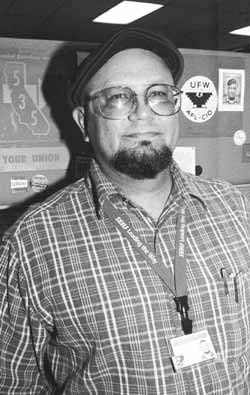 Robert Castillo nest to a UFW emblem