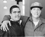 Tyler with his arm around a client