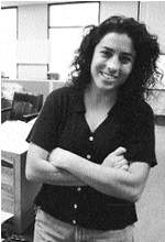 Fawnda Sandoval standing with a smile