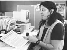 Margret Lipton looking with distress at a directive from the department