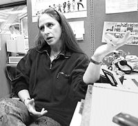 social worker at desk jesturing