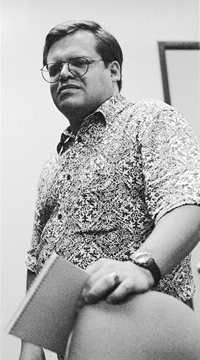 Socail worker standing looking concerned