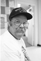 Michael wearing a baseball cap that says Native Viet Nam Vet"