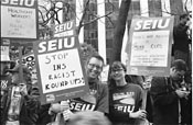 Local 535 intern Tonya Stoddard with SEIU sign protesting INS policies at anti-War demonstration