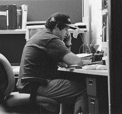 Terry Kalahar taking a phone call at his desk
