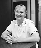 Carrol Vaughan sitting at a desk