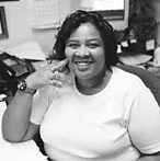 Whitfield at her desk