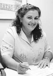 Sylvia Icenhour working at a desk