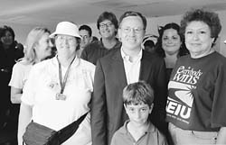 Vince Hall with a group of people, one woman wearing an SEIU  shirt